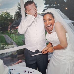 Tania in her strapless Sophia Tolli lace gown laughing with James during the cake cutting at The Clarendon Hotel, Blackheath.